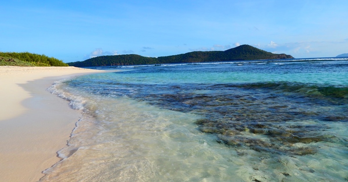 us virgin islands beach with green hills