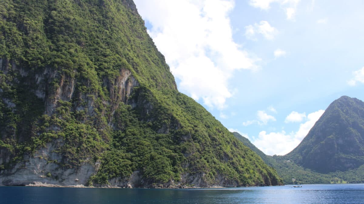 view of the pitons from the western coast of the island