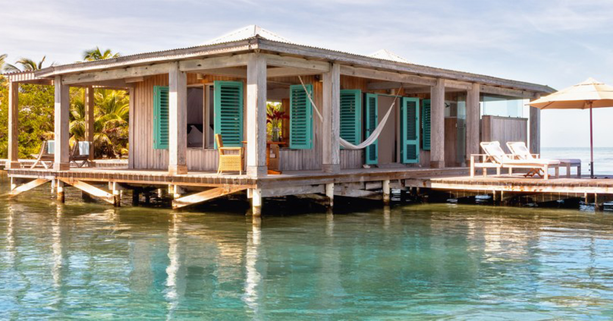 The Best Room at Cayo Espanto in Belize Is an Overwater Bungalow at the End of a 150-Foot Dock, With a Butler, a Sailboat, and Every Meal Included