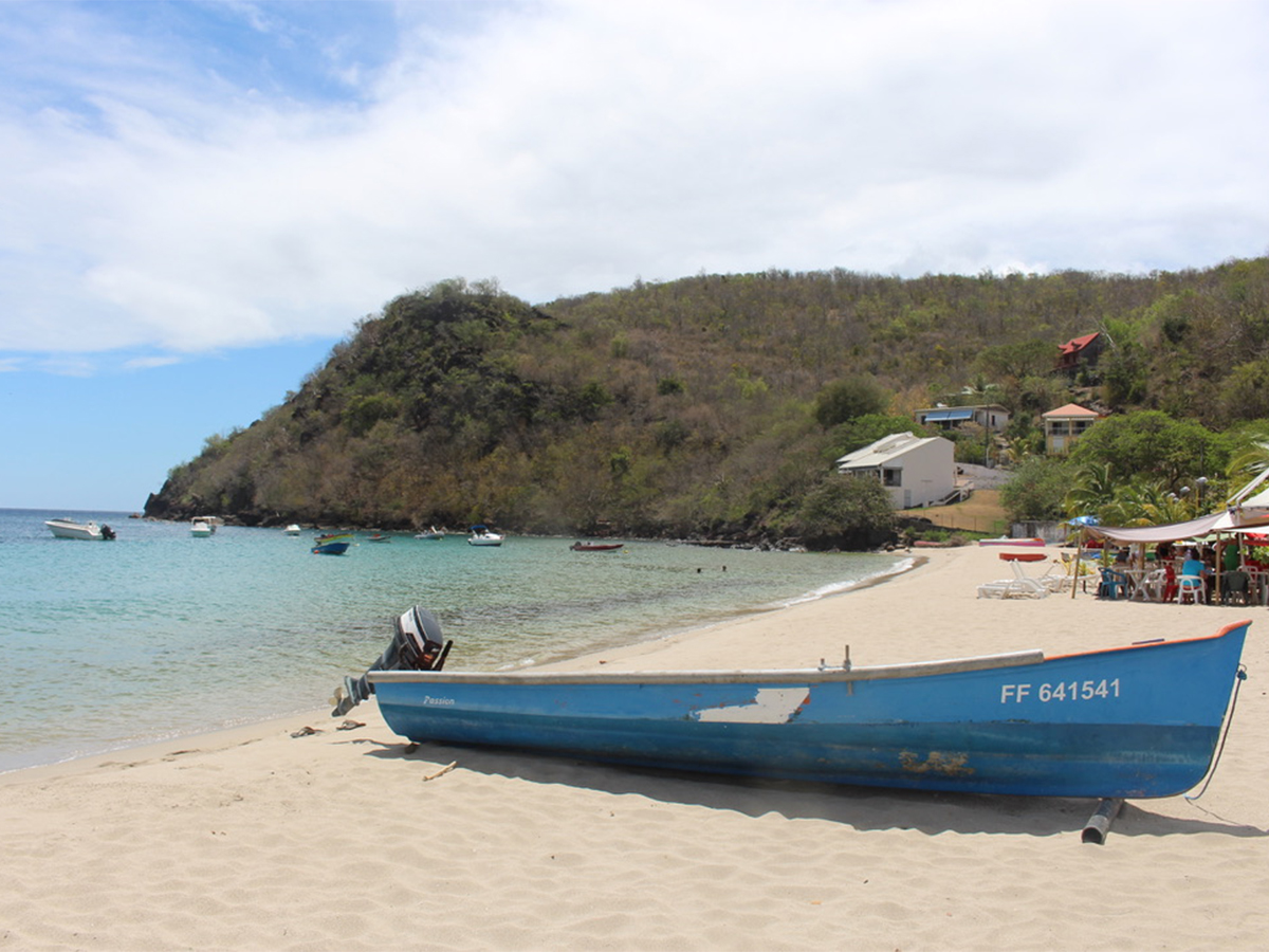 This Caribbean Beach Town Has Turquoise Coves, Waterfront Eateries, and One of the Most Beautiful Villages in the Region