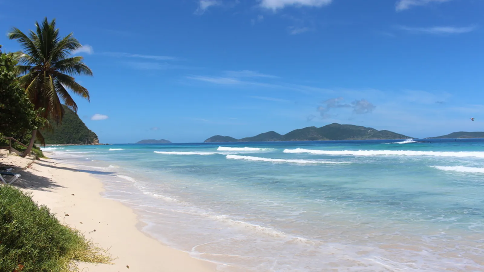 This Beach in Tortola Has White Sand, Green Hills, and a Breeze We Love